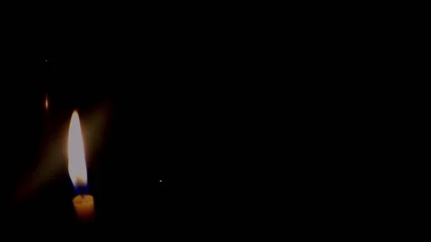 Isolated candle burning with dark background. Stock Footage 176467300