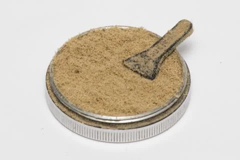 Isolated cannabis kief in a white background up close Stock Photos