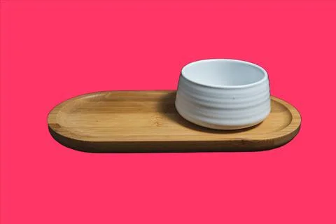 Isolated Ceramic mug of tea, made of white clay, on pink background. Stock Photos