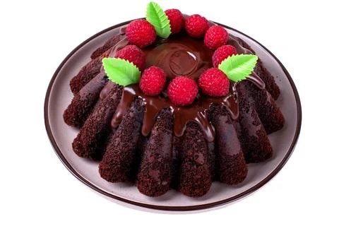 Isolated chocolate cake topped with raspberry Foto stock