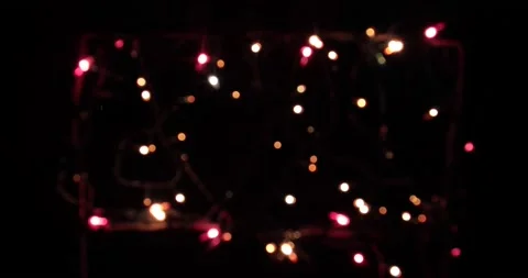 Isolated Christmas lights string, frame along the contour on a black background. Stock Footage 146726156