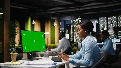 Isolated chroma key on desktop pc with black analyst analyzing KPI metrics Stock Photos