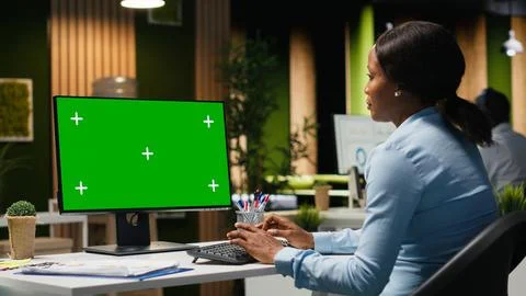 Isolated chroma key on desktop pc with black analyst analyzing KPI metrics Stock Photos