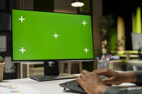 Isolated chroma key on desktop pc with black analyst analyzing KPI metrics Stock Photos
