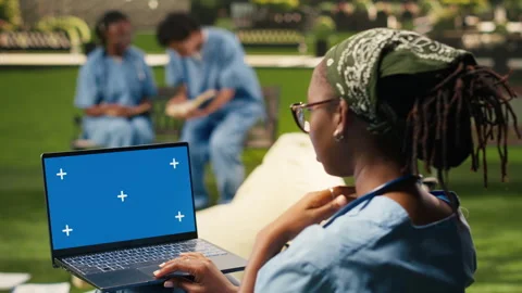 Isolated chroma key on laptop with blue screen on student lap Stock Footage 340961560