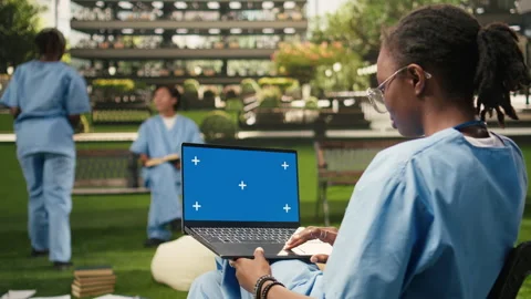 Isolated chroma key on laptop with blue screen on student lap Stock Footage 340963020