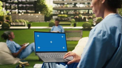 Isolated chroma key on laptop with blue screen on student lap Stock Footage 340963064