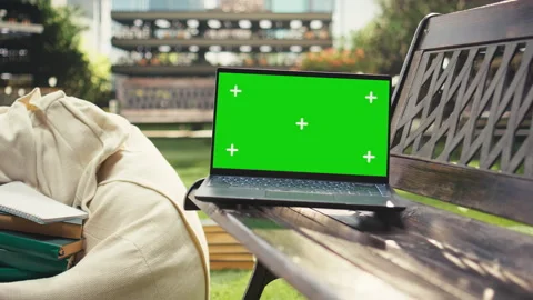 Isolated chroma key laptop placed on campus bench,= with beanbag Stock Footage 340803401