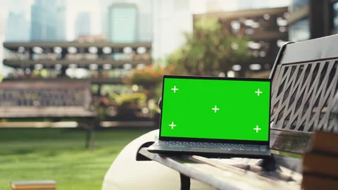 Isolated chroma key laptop placed on campus bench,= with beanbag Stock Footage 340810592