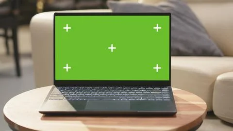 Isolated chroma key screen in cozy bright interior with coffee table Stock Photos