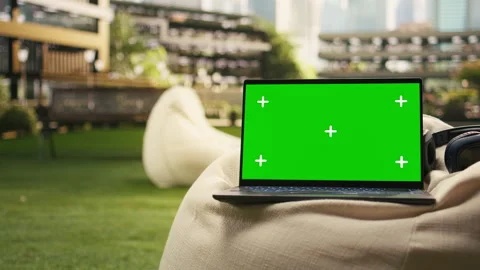 Isolated chroma key screen on laptop placed in outdoor campus Stock Footage 340961837