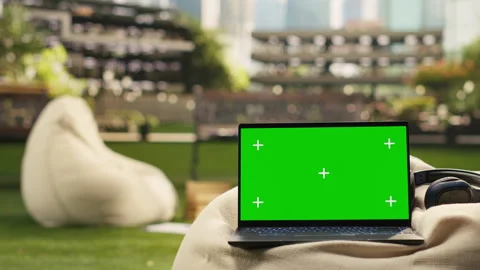 Isolated chroma key screen on laptop placed in outdoor campus Stock Footage 340963482