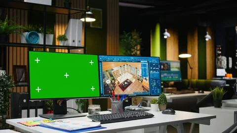 Isolated chroma key screen next to CAD software on multiple monitors Foto stock