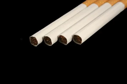 Isolated cigarette on a black background Stock Photos