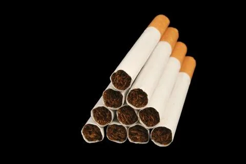 Isolated cigarettes on a black background Stock Photos