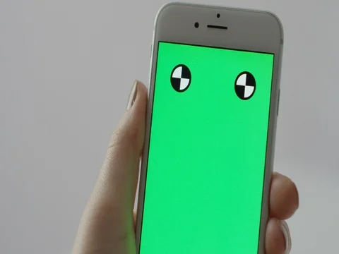 Isolated close up of phone, green screen with female hand swiping close up 動画素材 69284987