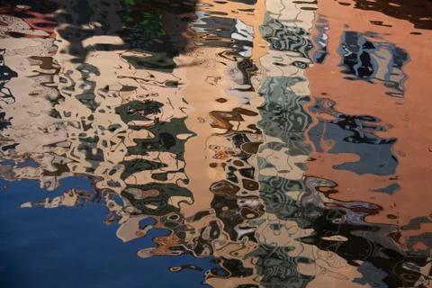 Isolated close-up of ripples on surface. reflection of building on ripples in Stock Photos