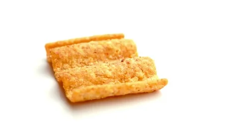 Isolated closeup of wholegrain rippled corn chip Stock Footage 75756946
