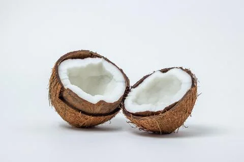 Isolated coconut on a white background. Two halves of a coconut.  Stock Photos