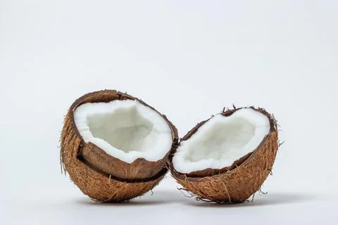 Isolated coconut on a white background. Two halves of a coconut.  Stock Photos