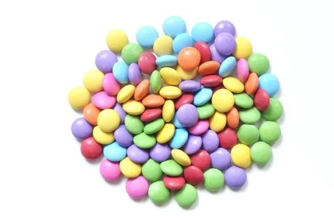 Isolated colored smarties on white background Stock Photos