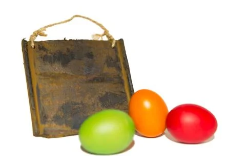 Isolated coloured easter eggs and board Fotos Stock