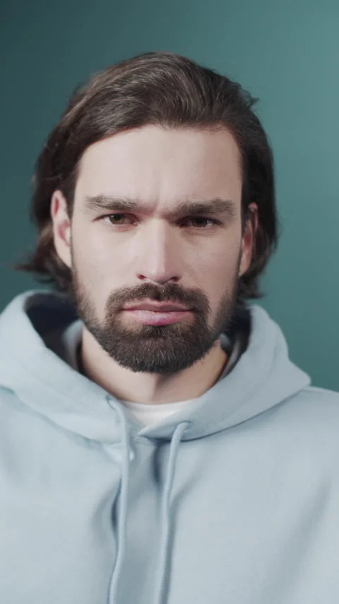 Isolated Dark-haired guy confused feels doubt while makes choice, dressed in 스톡 동영상 170673909