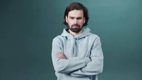 Isolated Dark-haired guy confused feels doubt while makes choice, dressed in Stock Footage 170796040