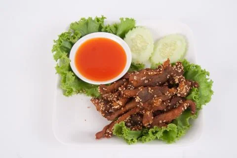 Isolated deep fried beef slice with herbs with delicious taste on white backg Stock Photos