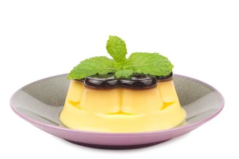 Isolated delicious egg pudding with mint Fotos Stock