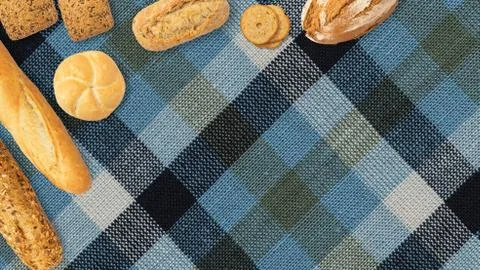 Isolated different kinds of bread on a tablecloth background. Photo of variet Stock Photos