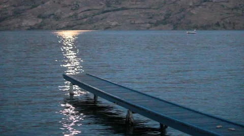 Isolated Dock and Shimmering Moonlit Waters Stock Footage 40300754