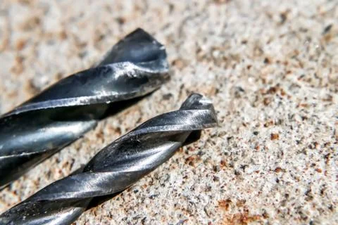 The Isolated Drill Bits with the Gray Ground Background Stock Photos