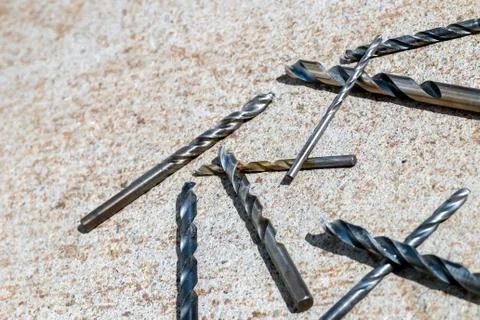 The Isolated Drill Bits with the Gray Ground Background Stock Photos