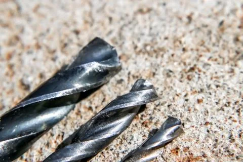 The Isolated Drill Bits with the Gray Ground Background Stock Photos