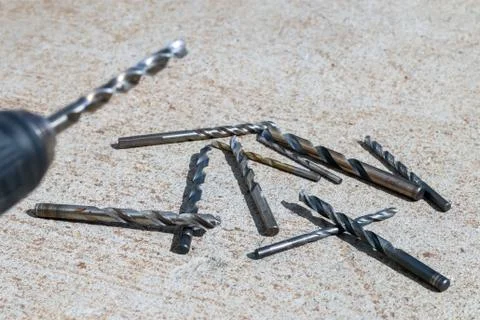 The Isolated Drill Bits with the Gray Ground Background Stock Photos