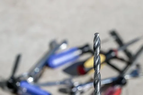 The Isolated Drill Bits with the Gray Ground Background Stock Photos