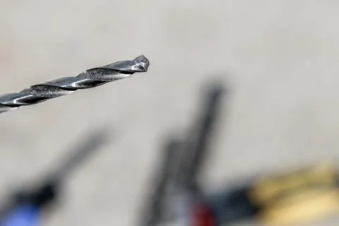 The Isolated Drill Bits with the Gray Ground Background Foto stock