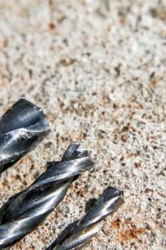 The Isolated Drill Bits with the Gray Ground Background Stock Photos
