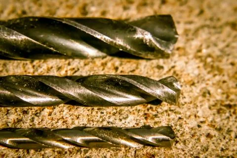 The Isolated Drill Bits with the Gray Ground Background Stock Photos