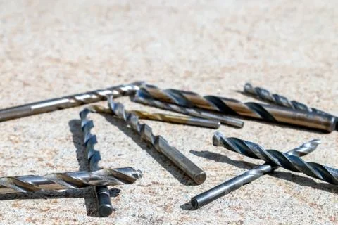 The Isolated Drill Bits with the Gray Ground Background Stock Photos