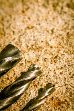 The Isolated Drill Bits with the Gray Ground Background Foto stock