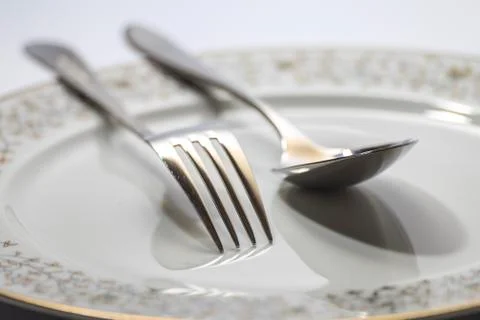 Isolated elegant Fork, spoon and plate for design Foto stock