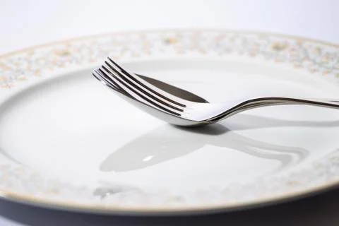 Isolated elegant Fork, spoon and plate for design Фото