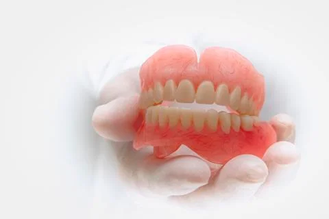 Isolated. False teeth prosthesis. Doctor Dentist. Stock Photos