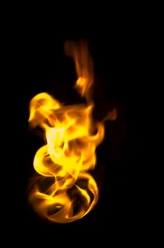 Isolated fire flames on black background, darkness Illustrazione stock