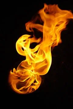 Isolated fire flames on black background, darkness fire with a black backg... Foto stock