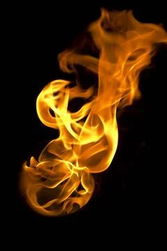 Isolated fire flames on black background, darkness fire with a black backg... Stock Photos