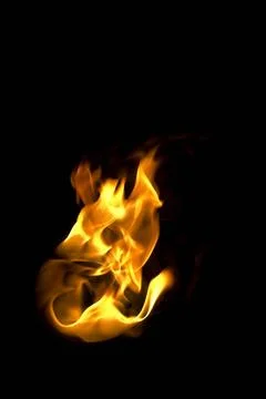 Isolated fire flames on black background, darkness fire with a black backg... Stock Photos