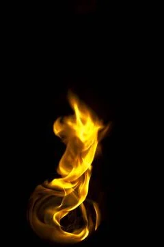 Isolated fire flames on black background, darkness fire with a black backg... Stock Photos